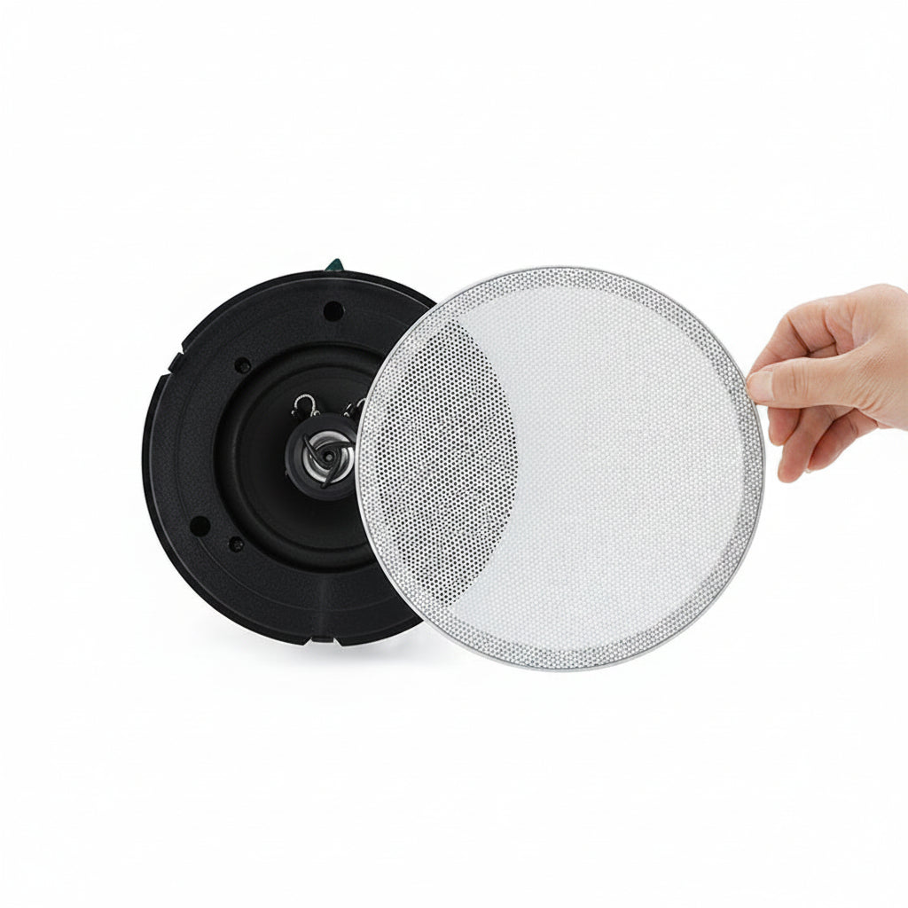 Speaker with a hand holding a grille on a white background