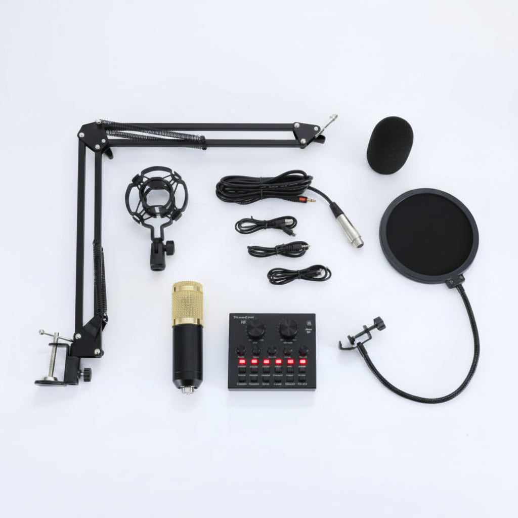 A studio microphone set including a microphone with pop filter, sound card, cables, and mounting equipment laid out on a white surface.